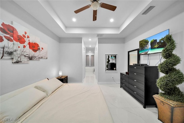 2330 6th Ave NE, Naples, FL 34120 - bedroom featuring ceiling fan, ensuite bathroom, and a tray ceiling