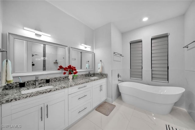 2330 6th Ave NE, Naples, FL 34120 - bathroom featuring vanity and independent shower and bath