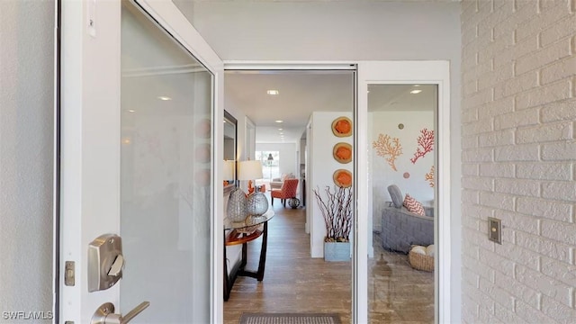 hallway with dark hardwood / wood-style flooring