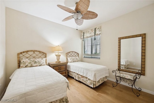 bedroom with ceiling fan and light hardwood / wood-style floors