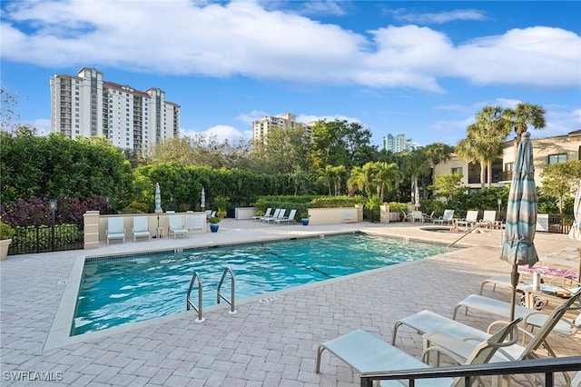 view of swimming pool with a patio area