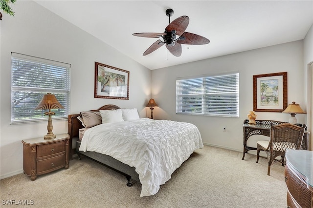 carpeted bedroom featuring ceiling fan and lofted ceiling