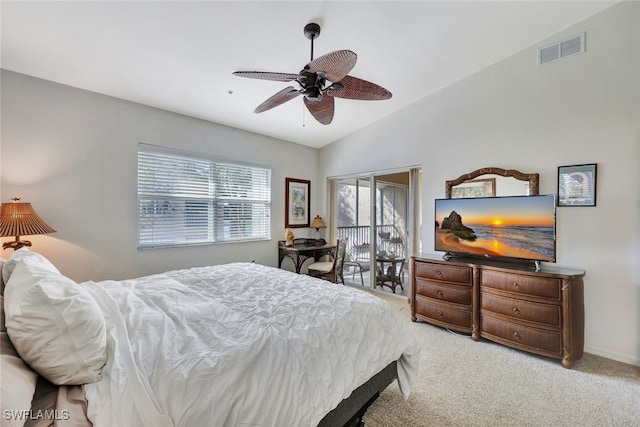 carpeted bedroom with vaulted ceiling and ceiling fan