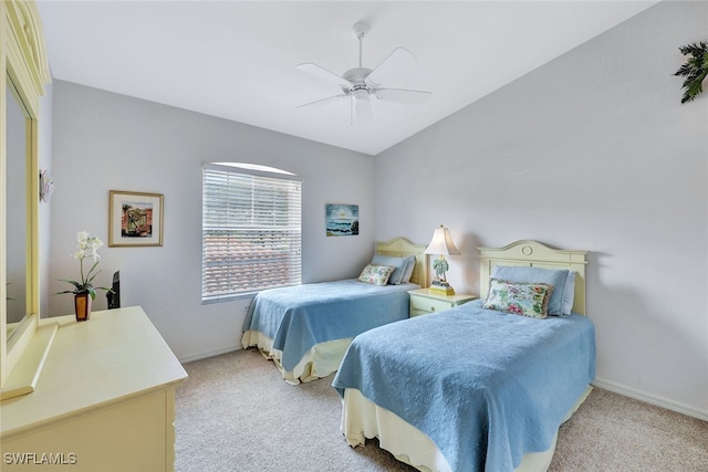 bedroom featuring light colored carpet and ceiling fan