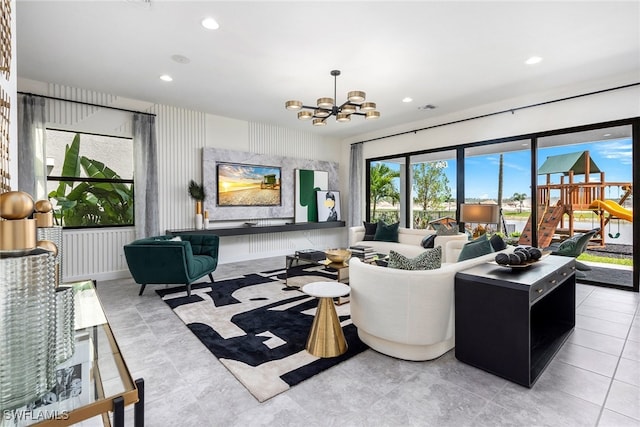 tiled living room featuring a chandelier