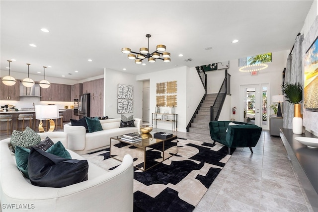 tiled living room with an inviting chandelier