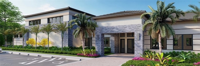 exterior space with uncovered parking, stone siding, and stucco siding