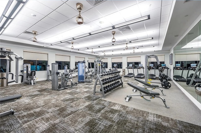 workout area featuring visible vents and carpet floors