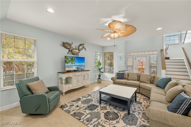 tiled living room with ceiling fan