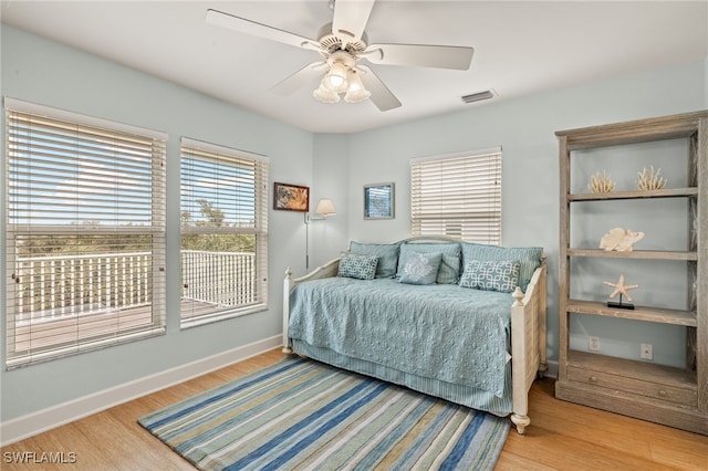 bedroom featuring ceiling fan and light hardwood / wood-style floors