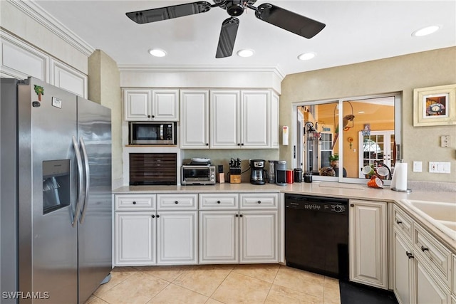 kitchen featuring light tile patterned floors, a toaster, stainless steel appliances, white cabinets, and light countertops