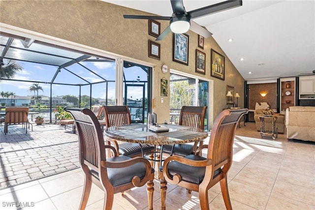 dining space featuring light tile patterned floors, ceiling fan, high vaulted ceiling, recessed lighting, and a sunroom