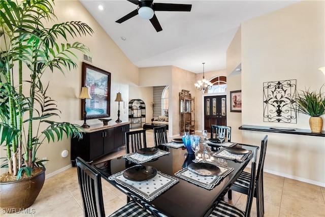 dining space featuring light tile patterned flooring, visible vents, baseboards, and ceiling fan with notable chandelier