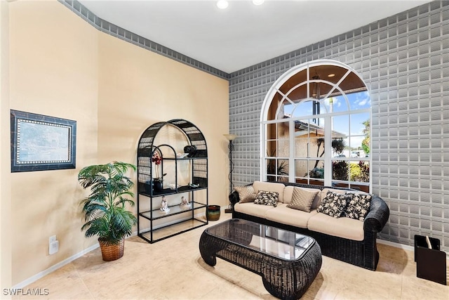 living room with tile patterned floors and baseboards