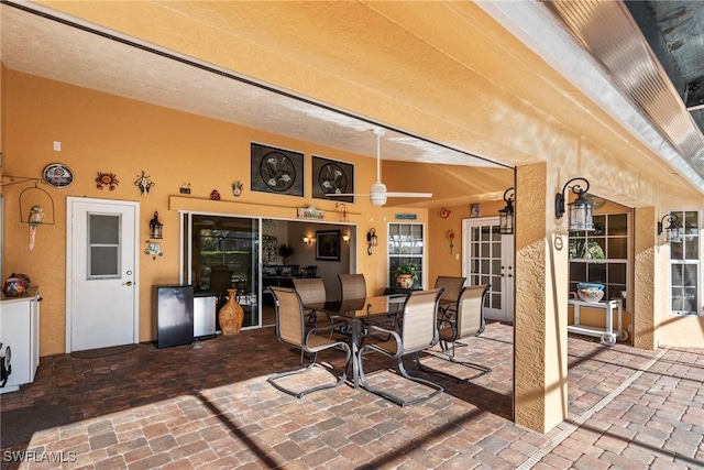 view of patio / terrace with outdoor dining area and a ceiling fan