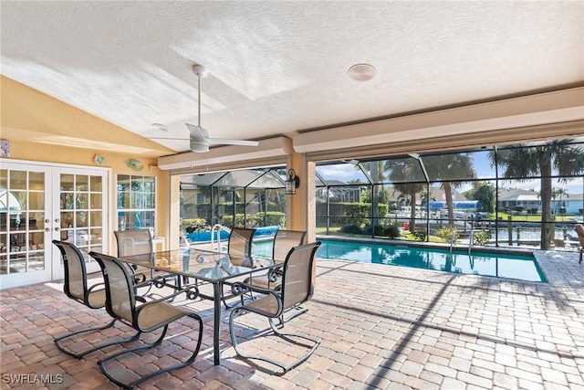 outdoor pool with french doors and ceiling fan