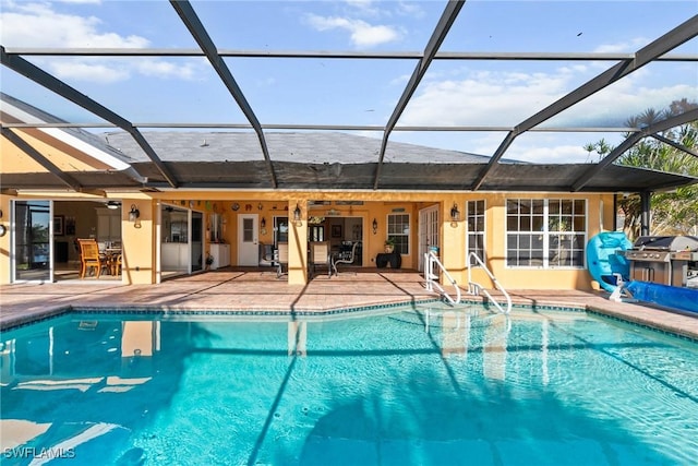 outdoor pool featuring a lanai and a patio