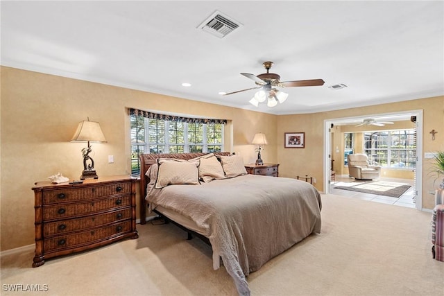 bedroom featuring light carpet, visible vents, and ornamental molding