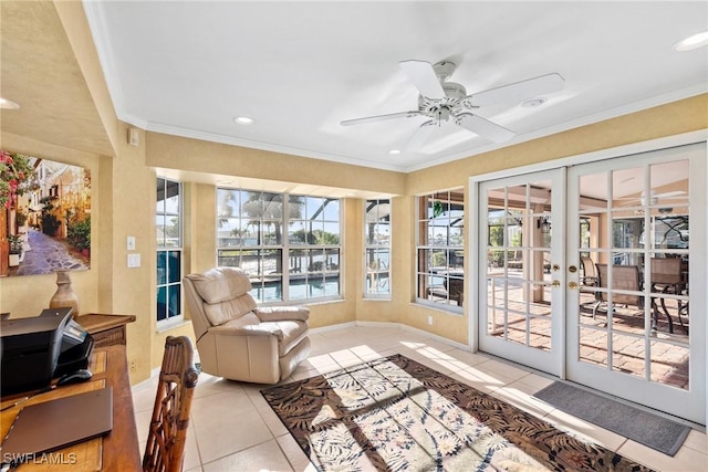 sunroom / solarium with french doors and ceiling fan