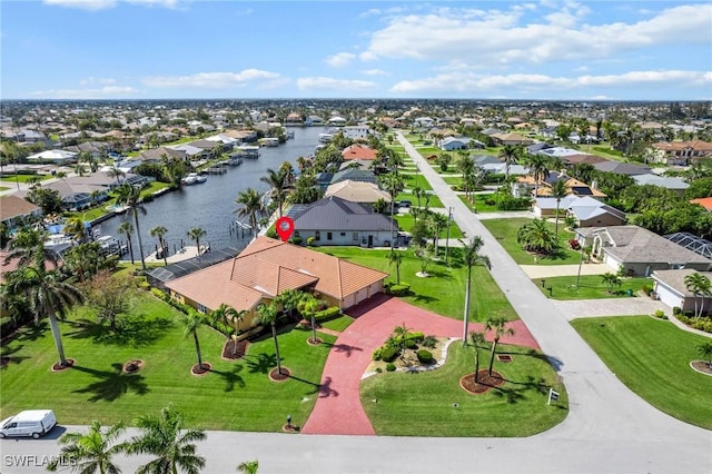 aerial view featuring a water view and a residential view