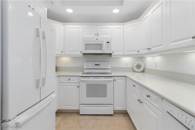 kitchen with white appliances and white cabinets