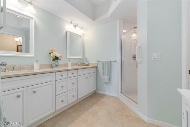 bathroom with tile patterned flooring, an enclosed shower, and vanity