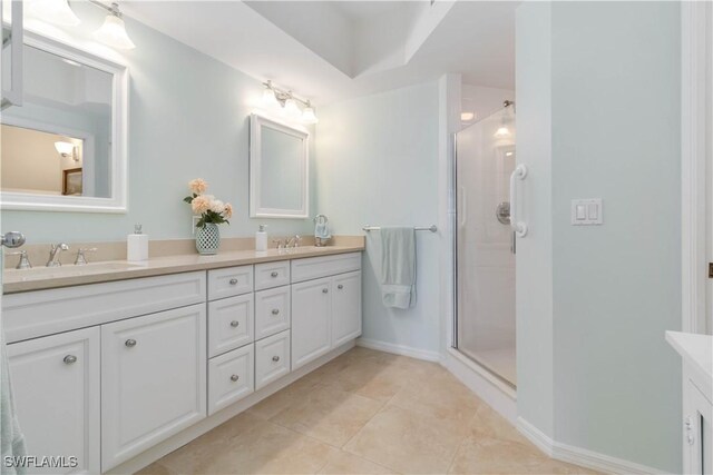 1001 Arbor Lake Dr Unit 1202, Naples, FL 34110 - full bathroom featuring a stall shower, double vanity, and tile patterned floors