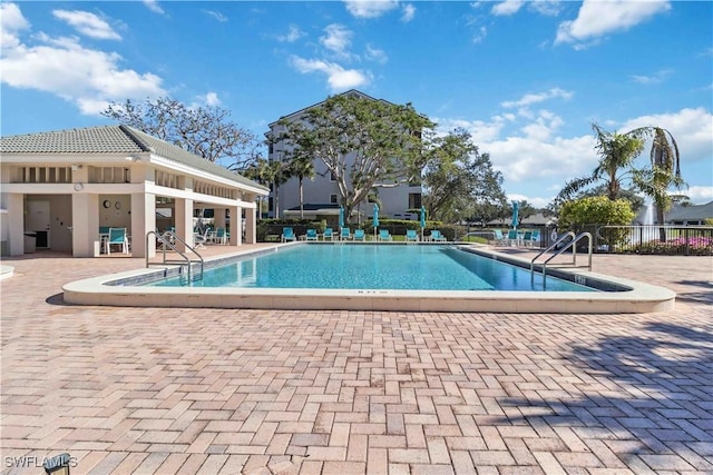 view of swimming pool with a patio area