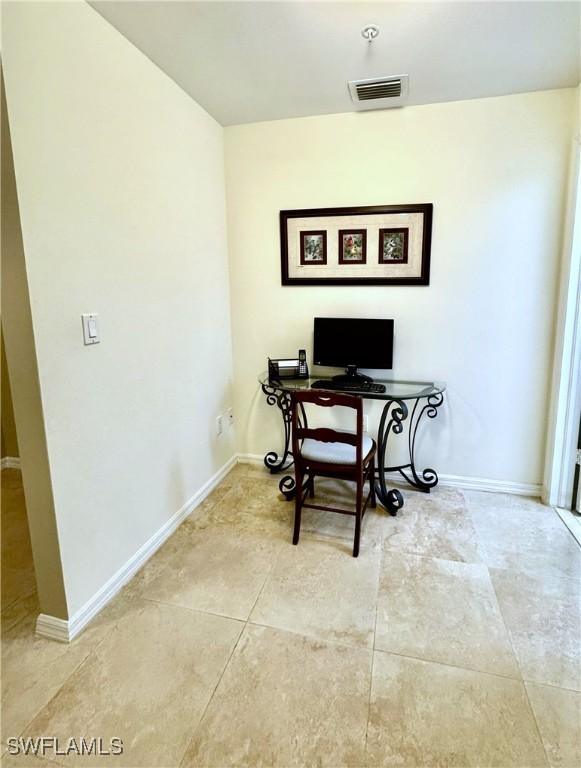 1001 Arbor Lake Dr Unit 1202, Naples, FL 34110 - office featuring tile patterned flooring and baseboards