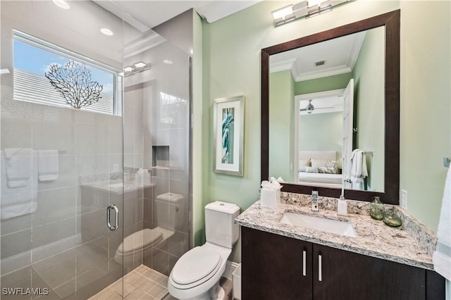 bathroom with crown molding, vanity, toilet, and an enclosed shower