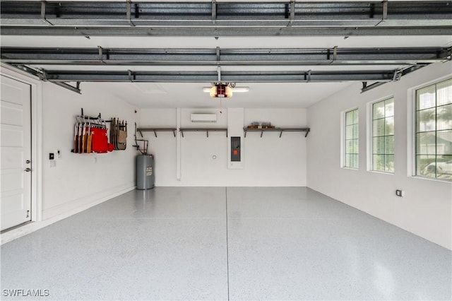 garage featuring water heater, a garage door opener, and electric panel