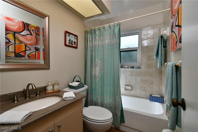 full bathroom featuring shower / tub combo with curtain, vanity, and toilet