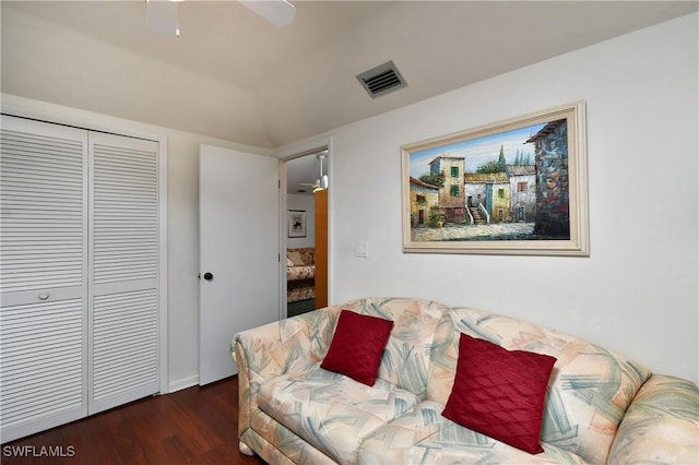 living room featuring ceiling fan, lofted ceiling, and dark hardwood / wood-style floors