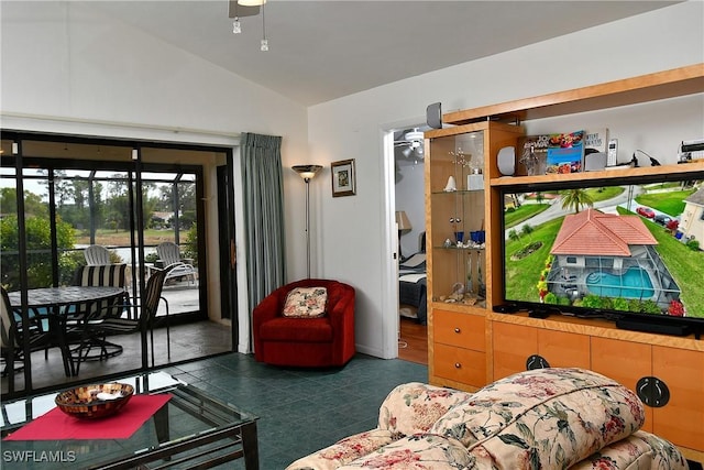 living room featuring lofted ceiling and ceiling fan