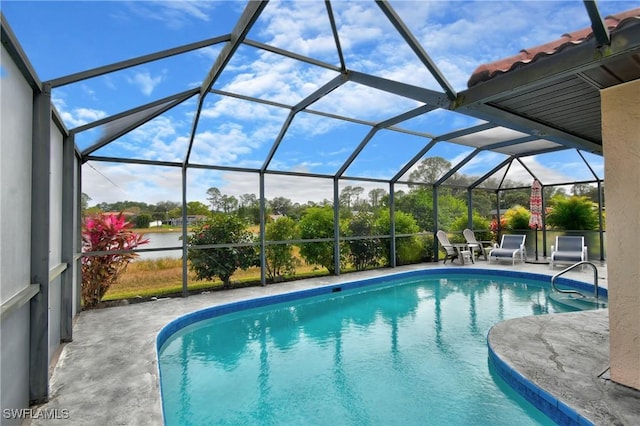 view of pool featuring a lanai and a patio