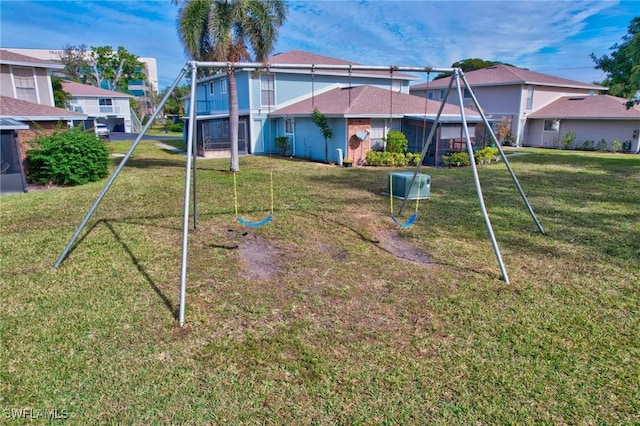 view of jungle gym featuring a lawn