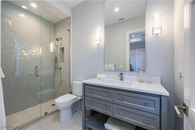 full bath with visible vents, toilet, a shower stall, vanity, and tile patterned floors