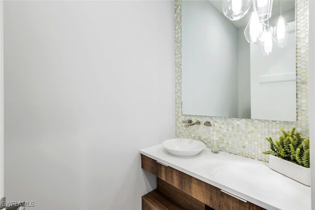 bathroom with vanity and backsplash