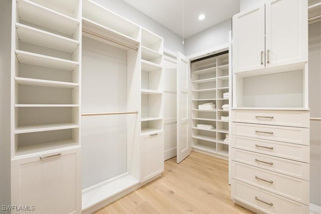 spacious closet with light wood-style flooring