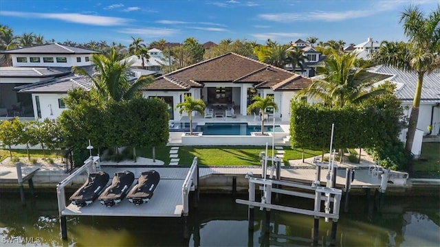 view of dock with an outdoor pool, boat lift, a residential view, a water view, and a patio area