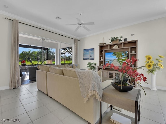 living room featuring crown molding, light tile patterned floors, and ceiling fan