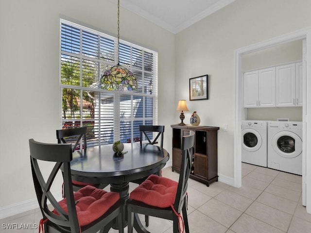 dining room featuring light tile patterned flooring, separate washer and dryer, and crown molding