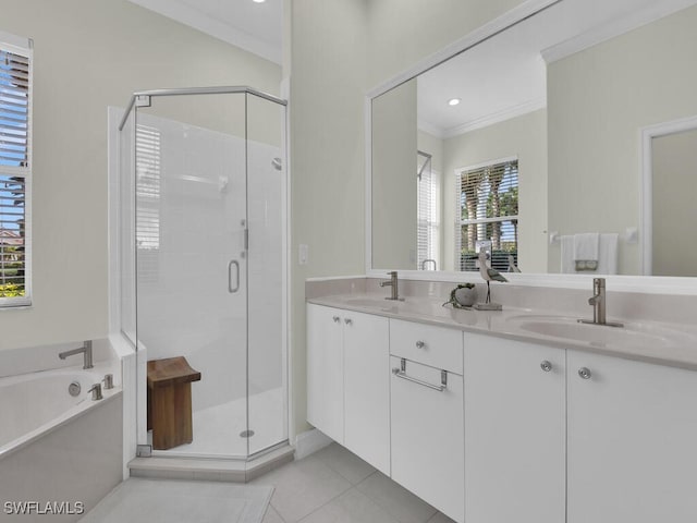 bathroom featuring tile patterned flooring, ornamental molding, shower with separate bathtub, and vanity