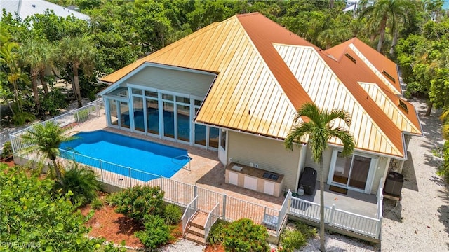 exterior space with a patio area, a fenced backyard, and a fenced in pool