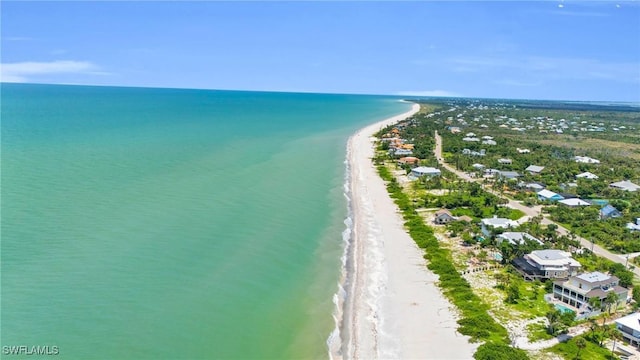 bird's eye view featuring a beach view and a water view