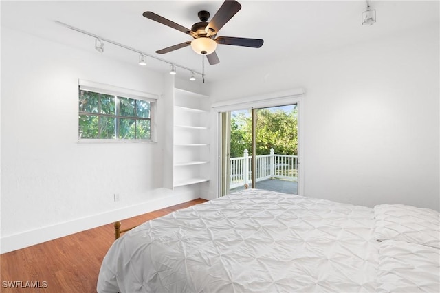 4090 W Gulf Dr, Sanibel, FL 33957 - bedroom featuring ceiling fan, wood finished floors, baseboards, and access to outside