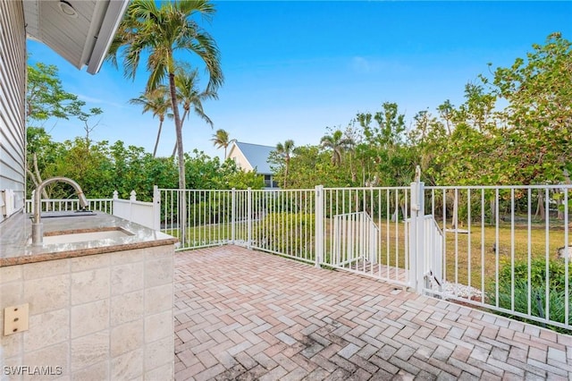 4090 W Gulf Dr, Sanibel, FL 33957 - view of patio with a sink