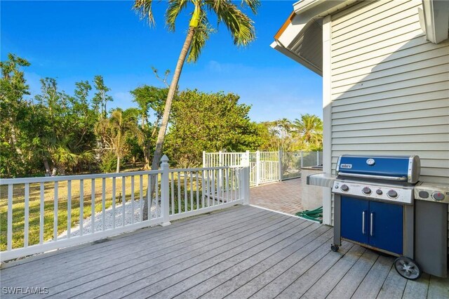 4090 W Gulf Dr, Sanibel, FL 33957 - wooden terrace with a grill