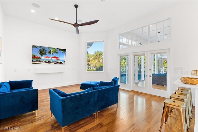 4090 W Gulf Dr, Sanibel, FL 33957 - living room with a ceiling fan, wood finished floors, recessed lighting, french doors, and baseboards
