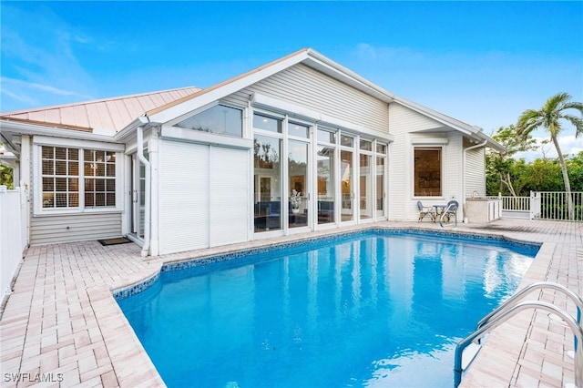 4090 W Gulf Dr, Sanibel, FL 33957 - back of property with a patio, fence, and an outdoor pool